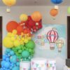 Фотозона с баннером и шариками для оформления помещения на праздник «Радужные флажки»